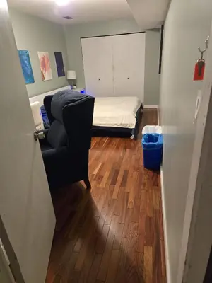 a room with a bed and a couch and a chair at Private Entrance OFFICE SPACE King Suite in Mission City