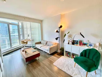 a living room with a couch and a table at 25 Days Minimum - Luxury and Modern Downtown Apartment - Do not send request for less than 21 days in Vancouver