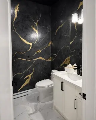 a bathroom with a toilet and a black and gold wallpaper at The Bear Cave - Artist-Inspired Suite in Langford