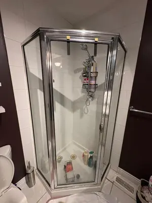 a shower with a glass enclosure in a bathroom at Oasis in Surrey