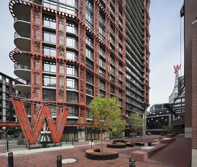 a tall building with a large sign in front of it at Luxury High Rise at Gastown Near BC Place in Vancouver