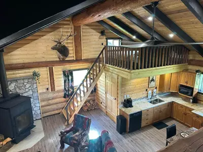 an overhead view of a log cabin with a staircase at The Yellowstone cabin - part of Bear Creek Cabins in Winfield