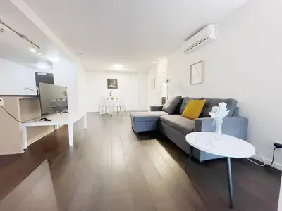 a living room with a couch and a table at Bright & Cozy 2B2B near transit in Richmond in Richmond