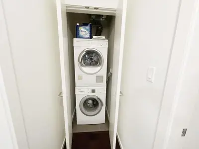 a washer and dryer in a small room at Bright & Cozy 2B2B near transit in Richmond in Richmond