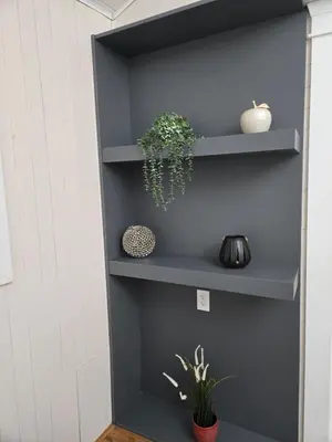a wall with shelves with plants on them at 3 BR Lux home with AC in a central location in Delta