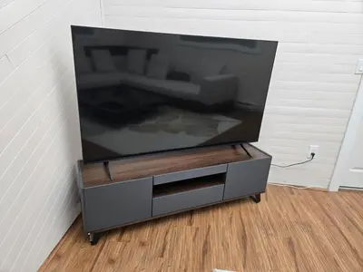 a large flat screen tv sitting in a wall at 3 BR Lux home with AC in a central location in Delta