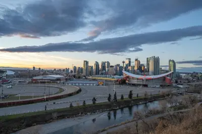 a view of a city with tall buildings and a river at Bright and Open Coziness. 10 minutes to Stampede in Calgary