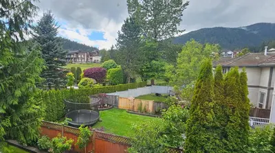 a backyard with a barbecue grill in the yard at Premium stay in Metro Vancouver-World Cup ready in Coquitlam