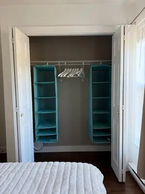 a bedroom with a closet with blue shelves and a bed at Private 1BR, AC, Strong Wi-Fi, Netflix and Amazon Prime in Victoria