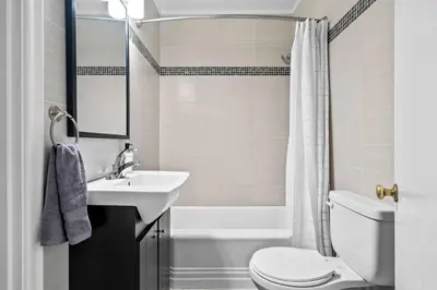 a bathroom with a sink and a toilet and a tub at Modern House-3BR/Spacious good for 8/Free Parking in Edmonton