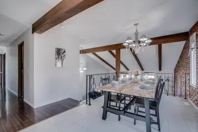 a dining room with a wooden table and chairs at Edmonton House w/5BR/3BA/2Kitchens & Fenced Yard in Edmonton