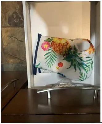 a purse with a pineapple on it sitting on a table at Canmore Mountain View in Canmore