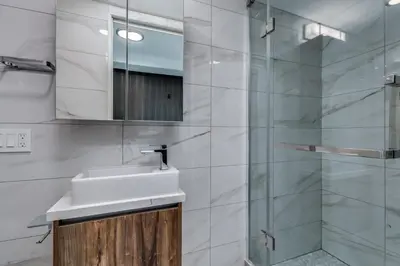 a bathroom with a sink and a shower at Luxury 2BR Walk to Everything Downtown in Vancouver
