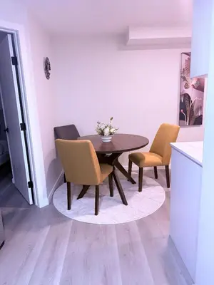 a dining room with a table and two chairs at Cozy Haven 2 in Bélanger