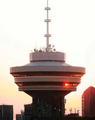 a control tower with a cross on top of it at City Line Views w Rooftop Patio in Vancouver
