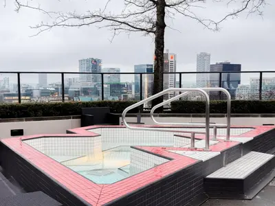 a glass table on top of a building at Gastown Unbeatable View 1 Bedroom High Floor Condo Rooftop View of Downtown in Vancouver