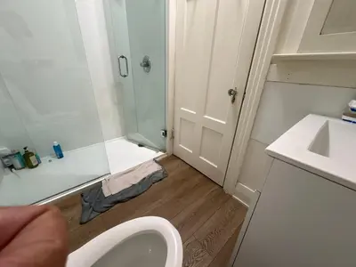 a small bathroom with a toilet and a sink at Vancouver Large Room for 5 - Near YVR Airport, Transit & Free Parking in Vancouver