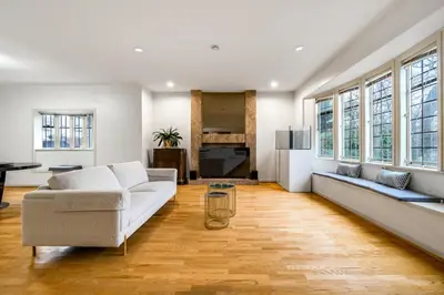 a living room with a couch and a table at Cozy & Modern Room near Langara & Downtown in Vancouver