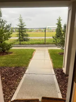 a view of a walkway from a window of a house at Spacious Private Room with TV, WiFi and Fridge in Edmonton