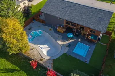 an overhead view of a house with a swimming pool at Big Bear Chalet and spa in Revelstoke
