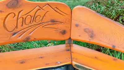 a wooden sign with the word chief written on it at Chalet Inn in Kitimat
