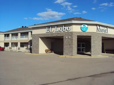 a large building with aigel motel written on it at El Lobo Motel in Cold Lake