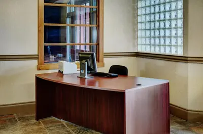 an office with a desk with a computer on it at Lakeview Inns & Suites - Fort Saskatchewan in Fort Saskatchewan