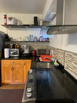 a kitchen with a sink and a counter top at Sunset Motel in Cache Creek