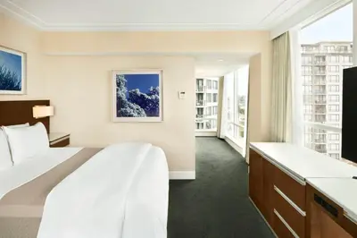 a hotel room with a bed and a large window at The Westin Wall Centre, Vancouver Airport in Richmond