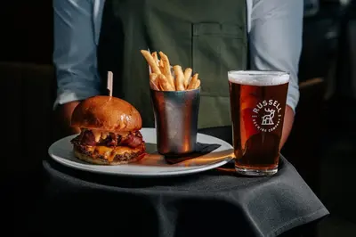 a sandwich and french fries and a glass of beer at The Westin Wall Centre, Vancouver Airport in Richmond