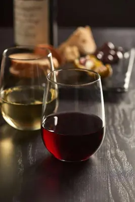 two glasses of wine sitting on a table at Hyatt Place Edmonton West in Edmonton