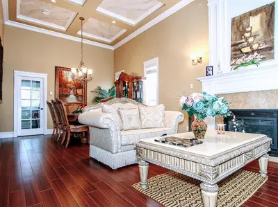a living room with a couch and a fireplace at Vancouver Luxury Homestay in Richmond