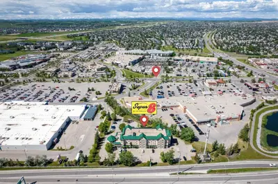 an aerial view of a parking lot with cars at Super 8 by Wyndham Calgary Shawnessy Area in Calgary