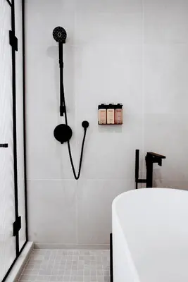 a bathroom with a shower and a bath tub at Hotel Arts in Calgary