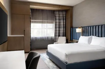 a hotel room with a bed and a window at Doubletree By Hilton West Kelowna in West Kelowna