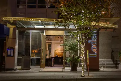 a facade of a building with lights on it at Loden Vancouver in Vancouver