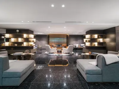 a living room with two couches and a table at Paradox Vancouver in Vancouver