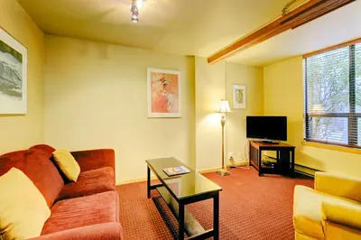 a living room with a couch and a tv at Swans Brewery, Pub & Hotel in Victoria
