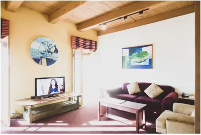 a living room with a couch and a table at Swans Brewery, Pub & Hotel in Victoria