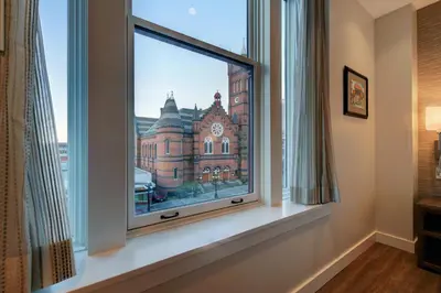 a window with a view of a building at Strathcona Hotel in Victoria