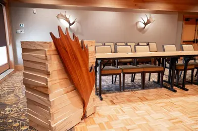 a dining room with a table and chairs at Moose Hotel and Suites in Banff