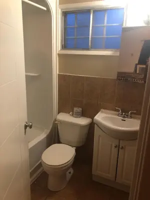 a bathroom with a toilet and a sink at Superlodge Lloydminster in Lloydminster