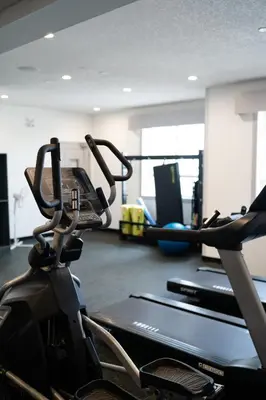 a gym with two tread machines and a treadmill at Best Western Plus Airdrie Gateway in Airdrie