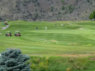 a group of people playing golf on a golf course at Overlander B&B in Kamloops