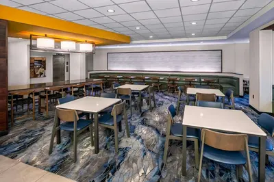 an empty dining room with tables and chairs at Fairfield Inn & Suites by Marriott Edmonton North in Edmonton