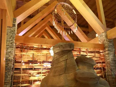 a room with a large stone statue and a ceiling at Sawridge Inn and Conference Centre Edmonton South in Edmonton
