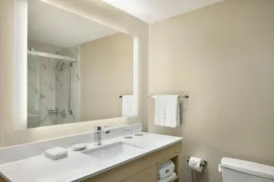 a bathroom with a sink and a mirror at The Westin Edmonton in Edmonton