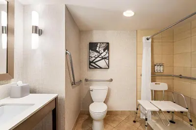 a bathroom with a toilet and a sink at Holiday Inn Express Vancouver-Metrotown (Burnaby) in Burnaby