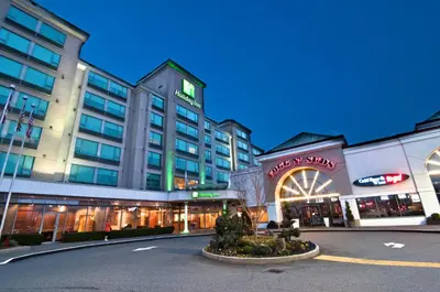 a large building with a street in front of it at Holiday Inn Vancouver Airport Richmond by IHG in Richmond
