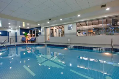 a large swimming pool in a hotel room at Holiday Inn Calgary Airport by IHG in Calgary